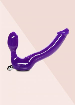 Feeldoe Classic purple strap-on with vibrator as seen in the erotic movie Silver Shoes directed by Jennifer Lyon Bell for Blue Artichoke Films